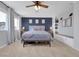 Spacious main bedroom with a cozy sitting bench, and a ceiling fan for added comfort at 18085 E 107Th Pl, Commerce City, CO 80022