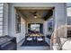 Charming covered patio with dining set, ceiling fan, and string lights for relaxed outdoor gatherings at 18085 E 107Th Pl, Commerce City, CO 80022