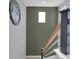 Green accent wall and modern railing on the staircase at 18085 E 107Th Pl, Commerce City, CO 80022