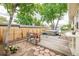 Relaxing backyard with a wooden deck and hot tub, perfect for outdoor entertaining at 5532 Umatilla St, Denver, CO 80221