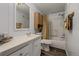 Cozy bathroom with lots of storage and a shower tub combo at 5532 Umatilla St, Denver, CO 80221