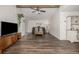 Spacious living room with wood floors, neutral decor, and lots of light at 5532 Umatilla St, Denver, CO 80221