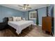 Cozy main bedroom with wood floors and a ceiling fan at 5532 Umatilla St, Denver, CO 80221
