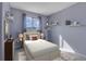 Cozy bedroom featuring a double bed and neutral color palette at 9359 W Lake Dr, Littleton, CO 80123