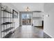 Dining area features sliding glass doors and kitchen with white cabinetry at 9359 W Lake Dr, Littleton, CO 80123