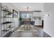 Charming dining area with modern light fixture and access to the deck at 9359 W Lake Dr, Littleton, CO 80123