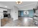 View of living room and kitchen featuring tile flooring and open layout at 9359 W Lake Dr, Littleton, CO 80123