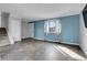 Bright living room with tiled floors, natural light, stairs and closet at 9359 W Lake Dr, Littleton, CO 80123