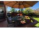 Deck with patio furniture, umbrella, and privacy fence at 2834 S Fig St, Lakewood, CO 80228