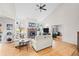 Spacious living room featuring hardwood floors, a fireplace, and vaulted ceilings at 2834 S Fig St, Lakewood, CO 80228