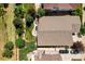 Aerial view of the roof and backyard with a fire pit and landscaped yard at 6988 S Riverwood Way, Aurora, CO 80016