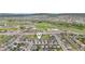 Aerial view of the property in a suburban neighborhood with shopping and dining nearby at 1607 Goldfield Trl, Castle Rock, CO 80109