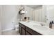 Stylish bathroom with double sinks, dark wood cabinets, and elegant towel storage, providing a luxurious feel at 1607 Goldfield Trl, Castle Rock, CO 80109