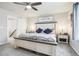 Spacious bedroom featuring a ceiling fan, neutral color scheme, and plush carpeting at 1607 Goldfield Trl, Castle Rock, CO 80109