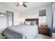 Comfortable bedroom features a large window, closet, and stylish grey and neutral color palette at 1607 Goldfield Trl, Castle Rock, CO 80109
