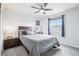 Cozy bedroom features a ceiling fan, large windows, plush carpeting and neutral color palette at 1607 Goldfield Trl, Castle Rock, CO 80109