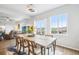 Dining area with large windows and sliding glass door that offer scenic views with a modern dining table at 1607 Goldfield Trl, Castle Rock, CO 80109