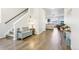 Bright foyer with hardwood floors, a bench, and views into the spacious living area at 1607 Goldfield Trl, Castle Rock, CO 80109