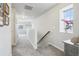 Upstairs hallway with carpet floors, natural light, and access to multiple rooms at 1607 Goldfield Trl, Castle Rock, CO 80109