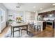 Open-concept kitchen with a large island, stainless steel appliances, and an adjacent dining area at 1607 Goldfield Trl, Castle Rock, CO 80109