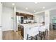 Bright kitchen with stainless steel appliances, a large island with bar seating, and ample cabinet space at 1607 Goldfield Trl, Castle Rock, CO 80109