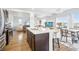 Open-concept kitchen featuring stainless appliances, eat-in island, and a view into the living room at 1607 Goldfield Trl, Castle Rock, CO 80109