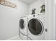 Well-equipped laundry room featuring modern washer and dryer units, offering convenience and efficiency at 1607 Goldfield Trl, Castle Rock, CO 80109