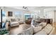 Spacious living room with hardwood floors, comfortable seating, and an aquarium at 1607 Goldfield Trl, Castle Rock, CO 80109