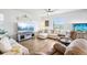 Bright, open living area with hardwood floors, comfortable seating, and an aquarium at 1607 Goldfield Trl, Castle Rock, CO 80109