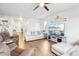 Bright living room with hardwood floors, comfortable seating, a ceiling fan, and lots of natural light at 1607 Goldfield Trl, Castle Rock, CO 80109