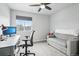 Bright home office with large window, grey sofa, ceiling fan and carpeting at 1607 Goldfield Trl, Castle Rock, CO 80109