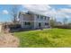 Spacious backyard with lush green grass and a patio for outdoor enjoyment at 957 Rosedale St, Castle Rock, CO 80104
