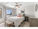Cozy bedroom with a queen-sized bed, neutral decor, and a window with natural light at 957 Rosedale St, Castle Rock, CO 80104