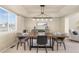 Elegant dining room with modern chandelier and a large window at 957 Rosedale St, Castle Rock, CO 80104
