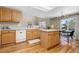 Bright eat-in kitchen featuring oak cabinets, white counters, and stainless appliances at 957 Rosedale St, Castle Rock, CO 80104
