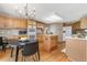 Spacious kitchen featuring wood cabinets, an island, and modern appliances at 957 Rosedale St, Castle Rock, CO 80104