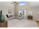 Bright living room with large windows, comfortable seating, and a ceiling fan at 957 Rosedale St, Castle Rock, CO 80104