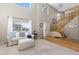Bright, modern living room featuring soaring ceilings, large windows, and hardwood accents at 957 Rosedale St, Castle Rock, CO 80104