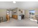 Bright loft area with a built-in desk, cabinetry, and a cozy reading corner by the window at 957 Rosedale St, Castle Rock, CO 80104