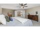 Serene bedroom with neutral tones, a comfortable bed, and double doors leading to another room at 957 Rosedale St, Castle Rock, CO 80104