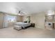 Spacious main bedroom featuring a large window, decorative accents, and a glimpse of the en-suite bathroom at 957 Rosedale St, Castle Rock, CO 80104