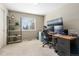 Functional office space with a large window, modern desk setup, and ample storage shelving at 957 Rosedale St, Castle Rock, CO 80104