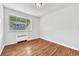 Bedroom featuring hardwood flooring and bright light from the window at 2100 N Franklin St # 15, Denver, CO 80205