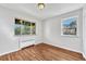 Bright bedroom with hardwood floors, two windows allowing for ample natural light, and a cozy atmosphere at 2100 N Franklin St # 15, Denver, CO 80205