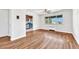Sunlit living room boasts gleaming hardwood floors, neutral walls, and an open layout leading to a modern kitchen at 2100 N Franklin St # 15, Denver, CO 80205