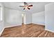 Spacious living room featuring hardwood floors and a ceiling fan for comfort at 2100 N Franklin St # 15, Denver, CO 80205
