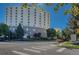 Modern building with surrounding trees and greenery at 2100 N Franklin St # 15, Denver, CO 80205