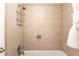 Shower and tub with tile surround at 5300 E Cherry Creek South Dr # 905, Denver, CO 80246