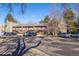 Condo building exterior showcasing parking and landscaping at 5300 E Cherry Creek South Dr # 905, Denver, CO 80246