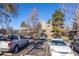 Exterior view of a condo building with ample parking at 5300 E Cherry Creek South Dr # 905, Denver, CO 80246